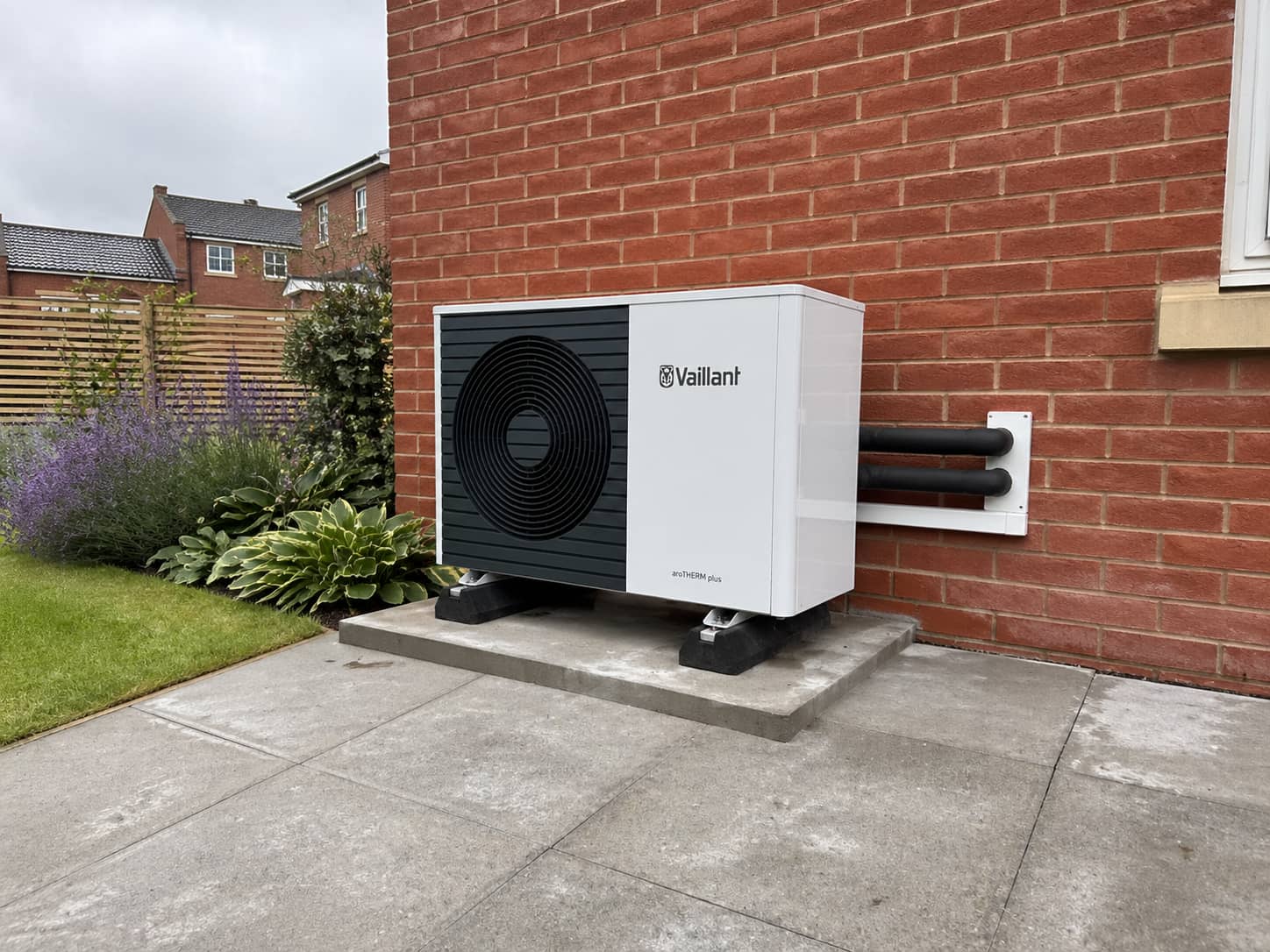 Air source heat pump unit installed beside a UK home